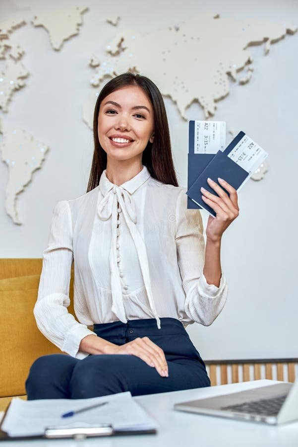 young-woman-travel-agent-flight-tickets-hands-attractive-139795385